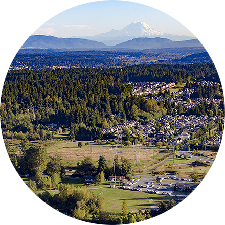 Landscape image of valley with Mt. Rainer in the background