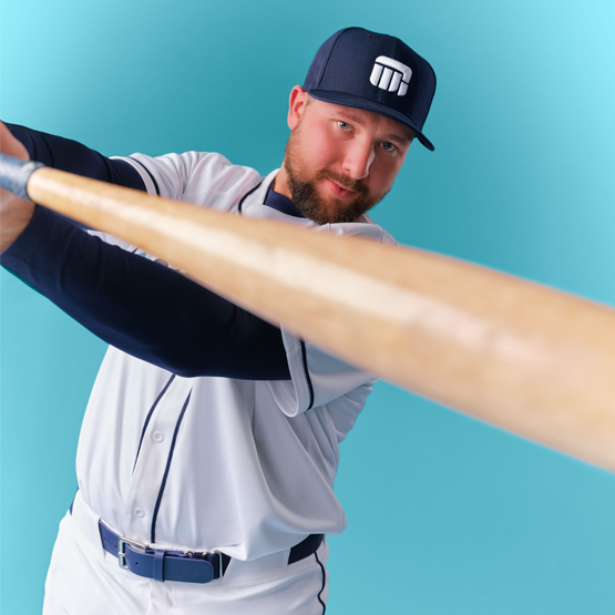 Cal Raleigh swinging a baseball bat