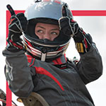 woman in motorcycle helmet giving thumbs up