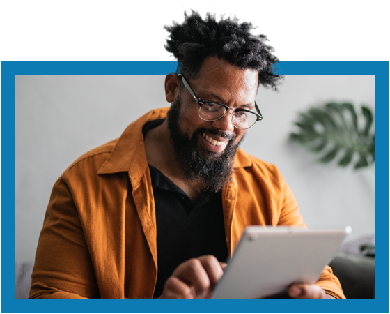 smiling black man using a tablet