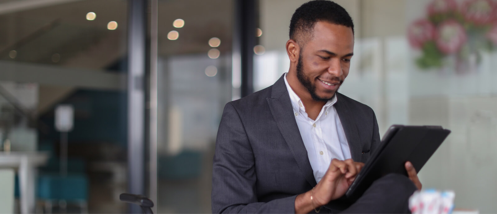 man using tablet in office