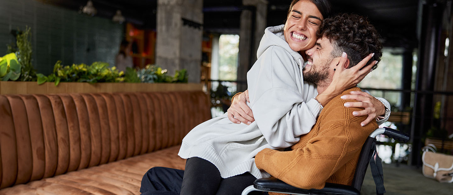 couple hugging in restaurant