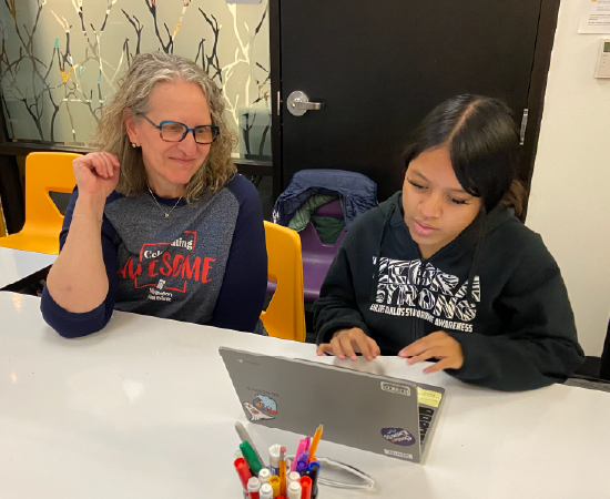 Washington Trust Bank volunteer provides financial literacy coaching at Lumen High School.