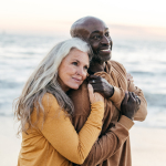 Mature couple embracing on a beach