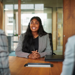 businesswoman smiling at table