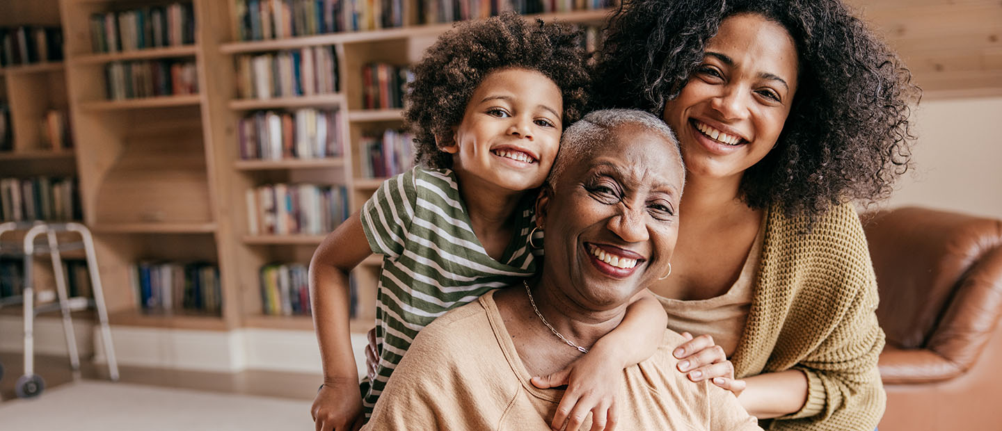 grandma, daughter and son sitting together happy