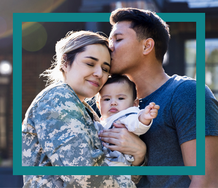 Hispanic family with baby, woman is wearing military fatigues