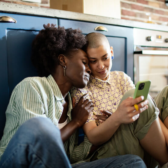 female couple looking at phone