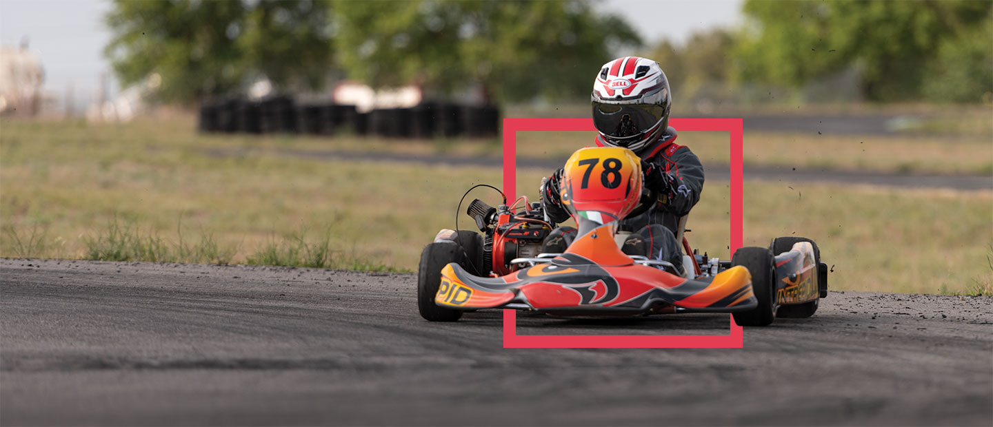 woman riding fast in go kart